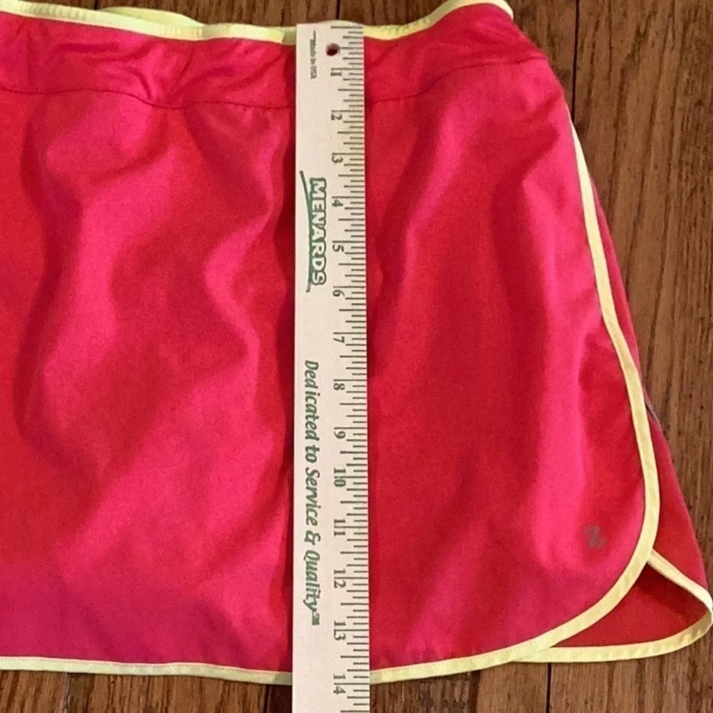 Izod cool-fx golf, tennis, hiking skort. Pink with yellow trim. Women’s size med